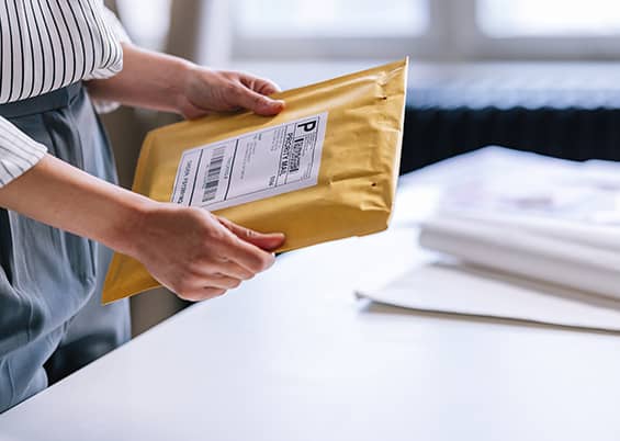 iStock-1397394728-sized Hand holding mail package
