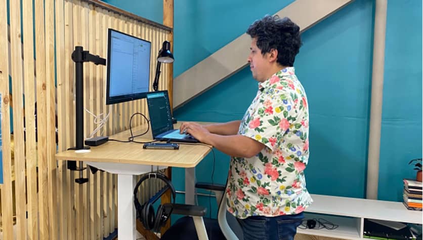 Person working on Stand up desk at Cowork + Connect, Hillcrest San Diego